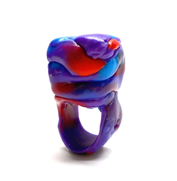 Bold statement ring made from recycled plastic — wearable sustainable art that's visually striking AND carries an eco story worth talking about.