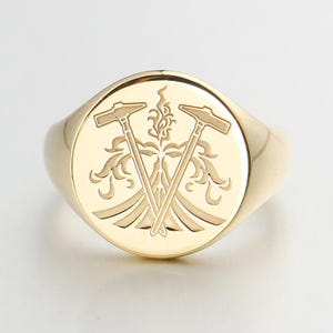 Mens Gold Signet Ring with Crossed Hammers and Flame