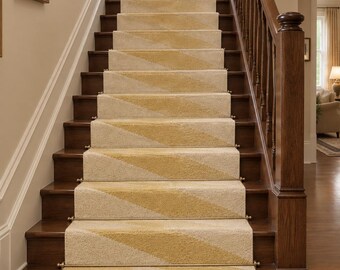 May include: A staircase runner featuring a geometric pattern of cream and mustard yellow diamonds. The runner is secured to the dark wood stairs with metallic gold stair rods, extending from the top landing down to the bottom floor.