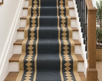 May include: A long stair runner rug featuring a solid dark charcoal grey centre panel flanked by two wide borders of natural tan jute. The tan borders are decorated with a repeating geometric diamond pattern in dark charcoal grey throughout the length.