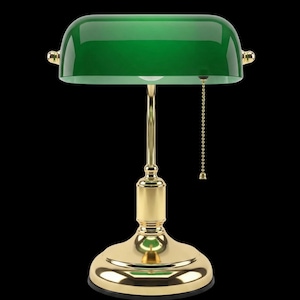 May include: A traditional banker's lamp with a glossy green glass shade and a gold-coloured metal base and stem. The lamp has a pull chain and a rounded shade design, suitable for a desk or side table.
