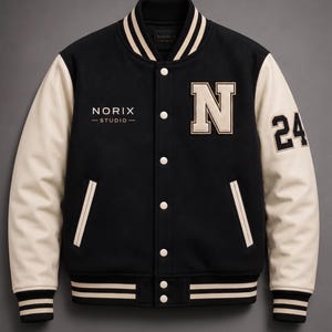 May include: Black varsity jacket with cream-colored sleeves, featuring the letter "N" and the number "24". The jacket has white stripes on the collar, cuffs, and hem, and the text "NORIX - STUDIO-" is embroidered on the chest.