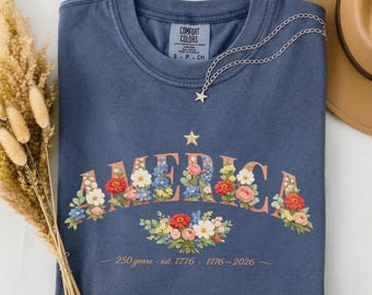 ワイルドフラワー・アメリカ・シャツ、アーチ型花柄Tシャツ、アメリカ建国250周年記念（1776-2026）、セミクインセンテニアル・コテージガーデン、女性用愛国心あふれるシャツ