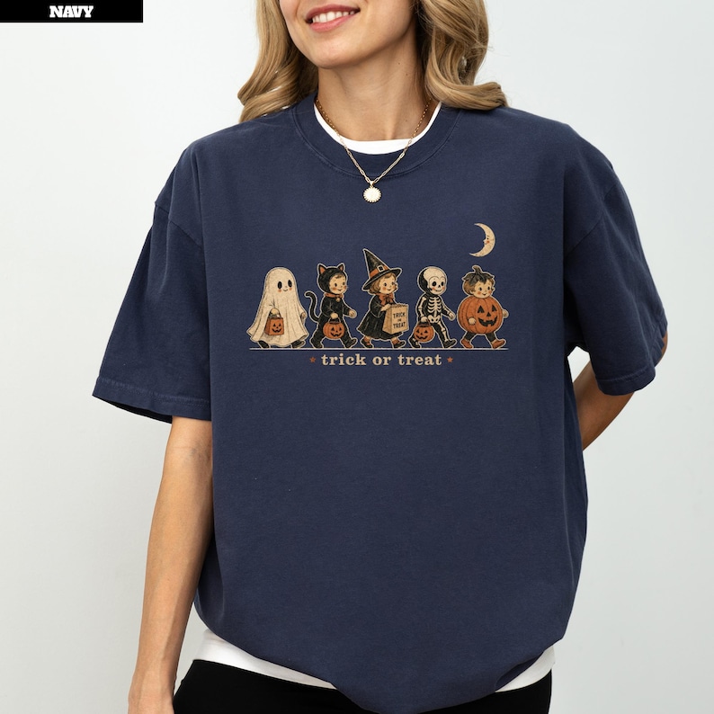 Navy sweatshirt with Halloween characters and "trick or treat" text.