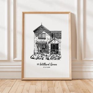 May include: A black and white line art illustration of a two-story house with a brick facade and a stone base, framed in a light wood frame. The text 11 Willard Grove and the date 01.01.2026 are printed in black below the house illustration.
