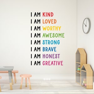 May include: A white wall with a rainbow-coloured motivational quote that reads "I am kind, I am loved, I am worthy, I am awesome, I am strong, I am brave, I am honest, I am creative".