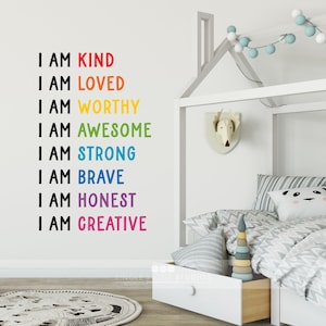 May include: A white wall with a rainbow-coloured decal that reads "I am kind, I am loved, I am worthy, I am awesome, I am strong, I am brave, I am honest, I am creative".