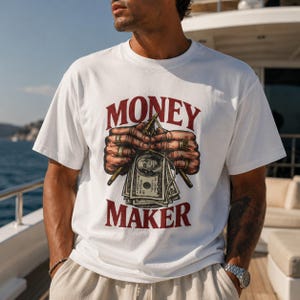 Money Maker T-shirt | Vintagehänder som håller kontanter-grafik