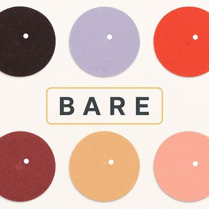 May include: Six circular discs in dark brown, light purple, bright orange, deep red, golden yellow, and soft pink, each featuring a small centered hole. The word BARE is printed in black capital letters inside a rectangular frame in the center.
