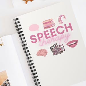 May include: A spiral-bound notebook with a white cover featuring the pink text "SPEECH therapy" surrounded by illustrations of a speech bubble, a stack of books, a hearing aid, a brain, a communication board, and a mouth with teeth.