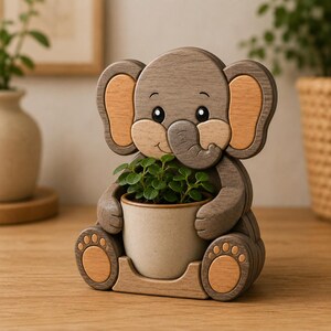 May include: A wooden elephant-shaped planter with a light brown pot holding a small green plant. The elephant has a gray body with light brown accents on the ears and feet. The planter is sitting on a wooden surface.