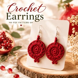 May include: Red crochet earrings in a pomegranate design, displayed on a white card. The earrings are handmade with a spiral pattern and silver-colored hooks. The image includes the text "Crochet Earrings PDF Pattern".
