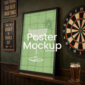 May include: A framed poster mockup with a green background and a cocktail illustration. A dartboard and a pint of beer are on a wooden bar. Signs read "Good Friends Cold Beer Great Times" and "Double In Double Out."