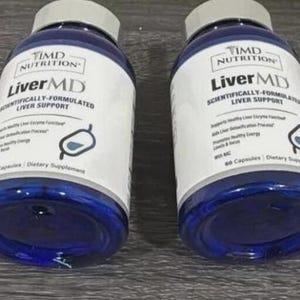 May include: Two blue bottles of LiverMD dietary supplement. Each bottle has a white label with black text, including the brand name, product name, and a graphic. The bottles have grey caps and contain 60 capsules.