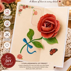 Puede incluir: Una tarjeta de felicitación pop-up con una rosa roja tridimensional, hojas verdes y una cinta azul sobre un fondo crema. La tarjeta incluye una pequeña ilustración de mariposa, detalles florales y el texto POP-UP ROSE GREETING CARD.
