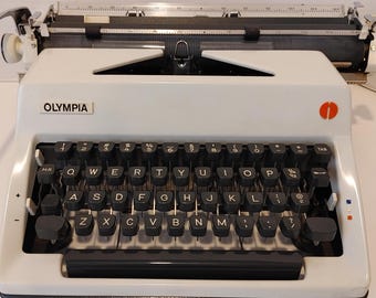 Máquina de escribir Olympia SM9 de 1971 con estuche, manual y funda originales - Excelente estado