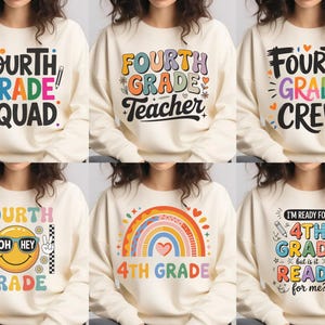 May include: Cream-colored sweatshirts with colorful text designs. The designs include phrases like "Fourth Grade Squad," "Fourth Grade Teacher," and "Fourth Grade Crew." Other designs feature rainbows and smiley faces, all related to the theme of fourth grade.