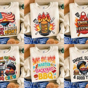 Könnte beinhalten: Cremefarbene Sweatshirts mit Grillmotiven. Die Designs zeigen eine amerikanische Flagge mit einem Grill, einen brennenden Burger, eine Grillschürze, ein grillendes Skelett und ein Bier mit einem Burger. Texte sind "Stars Smoke BBQ Night", "Smoke House Legends" und "BBQ Crew".