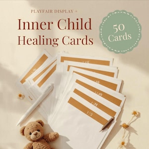 May include: A stack of white cards with gold accents, labeled "Inner Child Healing Cards" and "50 Cards." A white pen and a teddy bear are next to the cards. The cards have numbers printed on them.
