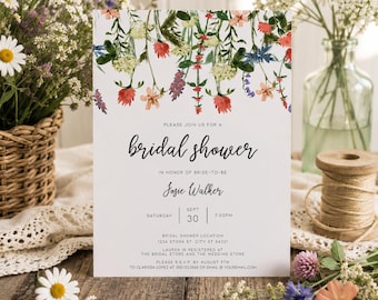 May include: A rectangular bridal shower invitation card featuring a watercolor floral border of red, yellow, and blue wildflowers at the top. The text reads: Please join us for a bridal shower in honor of bride-to-be Josie Walker, Saturday, Sept 30, 7:00 PM.