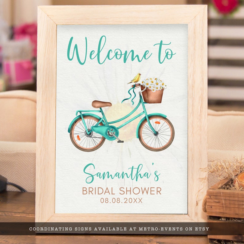 Rustic Bicycle and Daisy-Themed Bridal Shower Welcome Signs. This whimsical design is created with a vintage teal green bicycle with daisy accents and a yellow canary. Designed By MetroEvents.