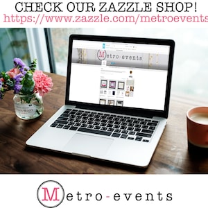 May include: A laptop displaying a website with framed art and decor. The screen shows the "Metro-events" logo. The text "CHECK OUR ZAZZLE SHOP!" and the website address are visible. A cup of coffee and a vase of flowers are on the wooden table.