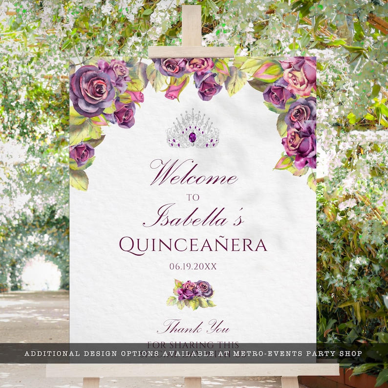 May include: Welcome to Isabella's Quincea&ntilde;era sign with purple roses and a silver tiara. The date 06.19.20XX is printed below the text.
