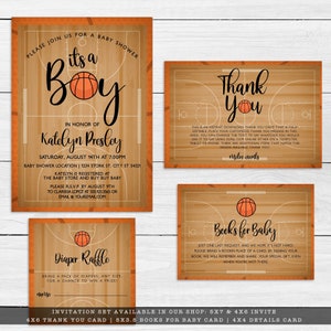 May include: A basketball-themed baby shower invitation set featuring a wood court design with orange basketball graphics. The set includes an invitation, thank you card, diaper raffle card, and books for baby card with black text.