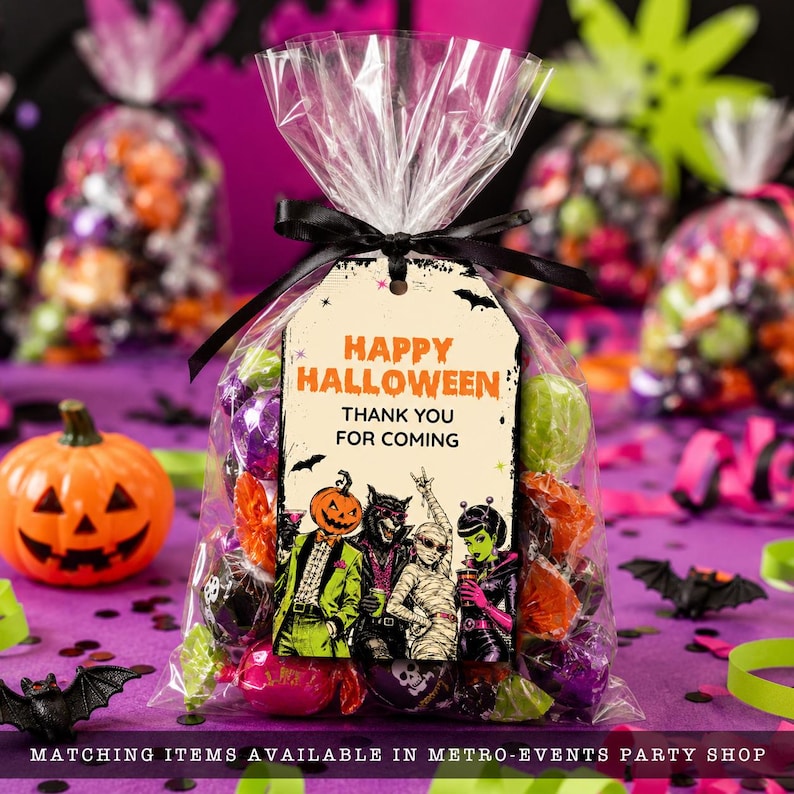 May include: A clear plastic treat bag filled with assorted candies, tied with a black ribbon and a tag that reads "HAPPY HALLOWEEN THANK YOU FOR COMING" above an illustration of a pumpkin-headed figure, a werewolf, a mummy, and a green-skinned alien.