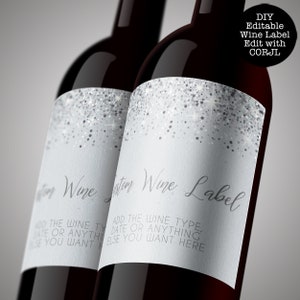 May include: Two wine bottles with silver glitter labels that say "Custom Wine Label". The labels have instructions to add the wine type, date, or anything else you want.