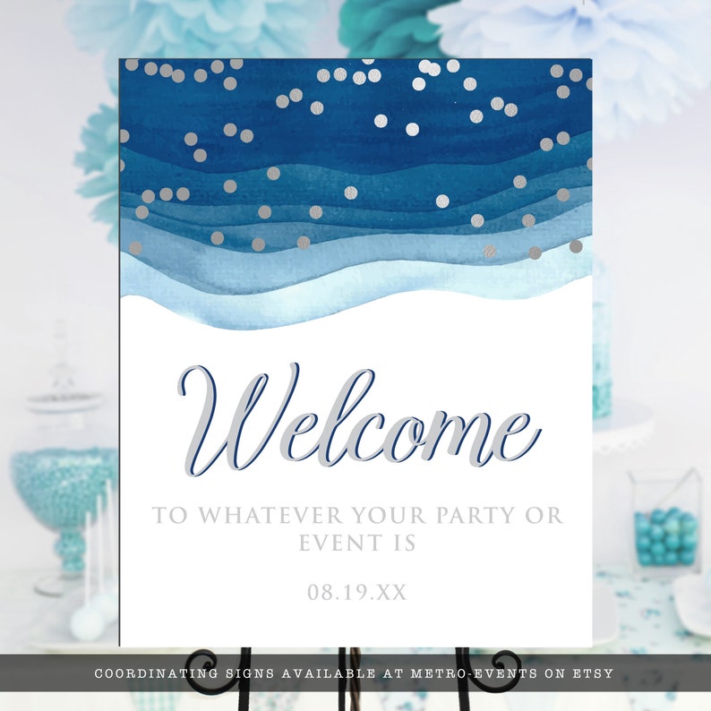 May include: A welcome sign with a watercolor design in shades of blue and silver confetti. The word "Welcome" is written in elegant script, with the text "TO WHATEVER YOUR PARTY OR EVENT IS" below. The date "08.19.XX" is also included.