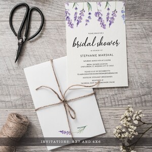 May include: A white bridal shower invitation card featuring watercolor lavender sprigs at the top and black text reading PLEASE JOIN US FOR A bridal shower IN HONOR OF STEPHANIE MARSHAL. A matching white envelope tied with brown twine is included.
