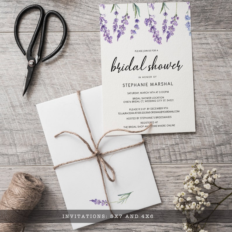 May include: A white bridal shower invitation card featuring watercolor lavender sprigs at the top and black text reading PLEASE JOIN US FOR A bridal shower IN HONOR OF STEPHANIE MARSHAL. A matching white envelope tied with brown twine is included.