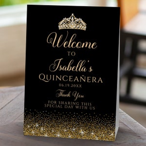 A sparkling-glam party theme, this glitzy welcome sign features faux gold glitter with a diamond and gold crown accent on a black background. Designed By MetroEvents.
