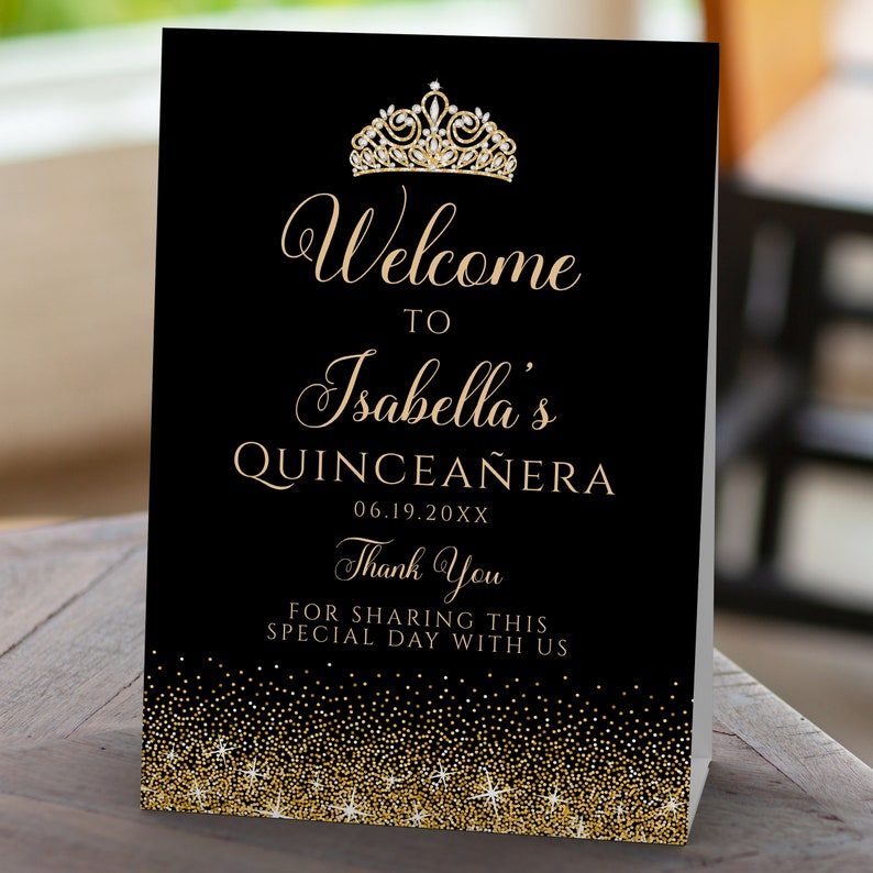 A sparkling-glam party theme, this glitzy welcome sign features faux gold glitter with a diamond and gold crown accent on a black background. Designed By MetroEvents.