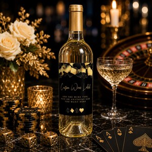 May include: A clear glass wine bottle with a gold foil cap and a black label featuring gold playing card suit icons. The label text reads Custom Wine Label and ADD THE WINE TYPE, DATE OR ANYTHING ELSE YOU WANT HERE in white and gold lettering.