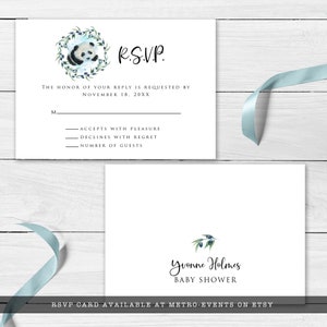 May include: White RSVP card with a panda bear illustration surrounded by a green wreath and blue berries. The card includes the text "R.S.V.P." and prompts for a reply by November 18, 20XX. A second card reads "Yvonne Holmes BABY SHOWER".