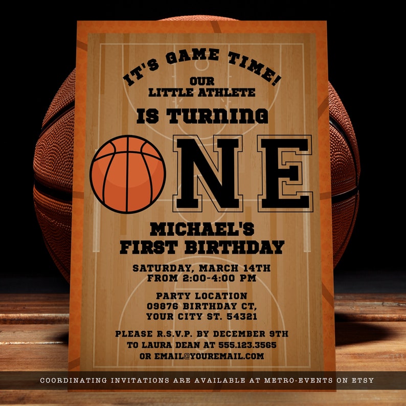 Basketball-themed first birthday invitations. Featuring a basketball court and ball background accented with a basketball and customizable typography. Designed By MetroEvents