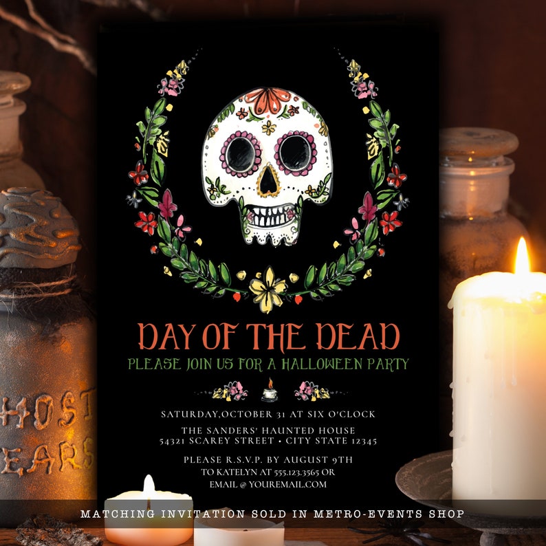 May include: A black rectangular invitation card featuring a white sugar skull illustration surrounded by a colorful floral wreath. The text reads: DAY OF THE DEAD, PLEASE JOIN US FOR A HALLOWEEN PARTY, SATURDAY, OCTOBER 31 AT SIX O'CLOCK.
