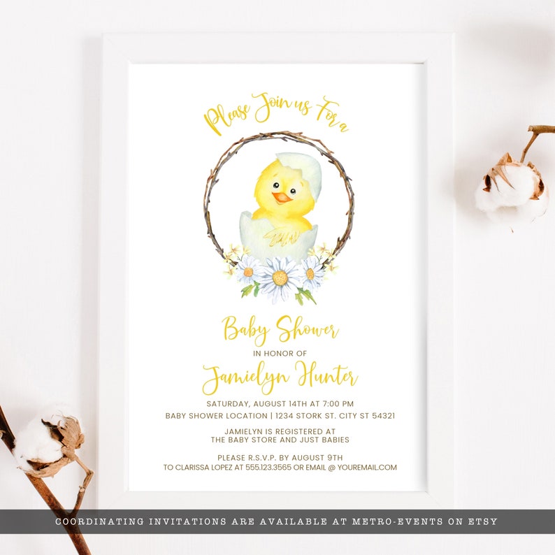 May include: Baby shower invitation featuring a watercolor illustration of a yellow chick hatching from an egg, surrounded by a floral wreath. The invitation includes event details in gold script, such as the date, time, and location.