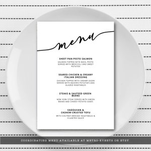 May include: A black and white menu card with the word "menu" written in cursive at the top. The menu lists four different food options: Sheet Pan Pesto Salmon, Seared Chicken & Creamy Italian Dressing, Steaks & Sauteed Green Beans, and Vadouvan & Cashew-Crusted Tofu. The bottom of the card reads "Coordinating Menu Available at Metro-Events on Etsy."