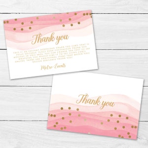 May include: Two pink and gold thank you cards. The cards feature a watercolor design with pink waves and gold polka dots. The words "Thank you" are written in gold script. The cards also include additional text about customization.