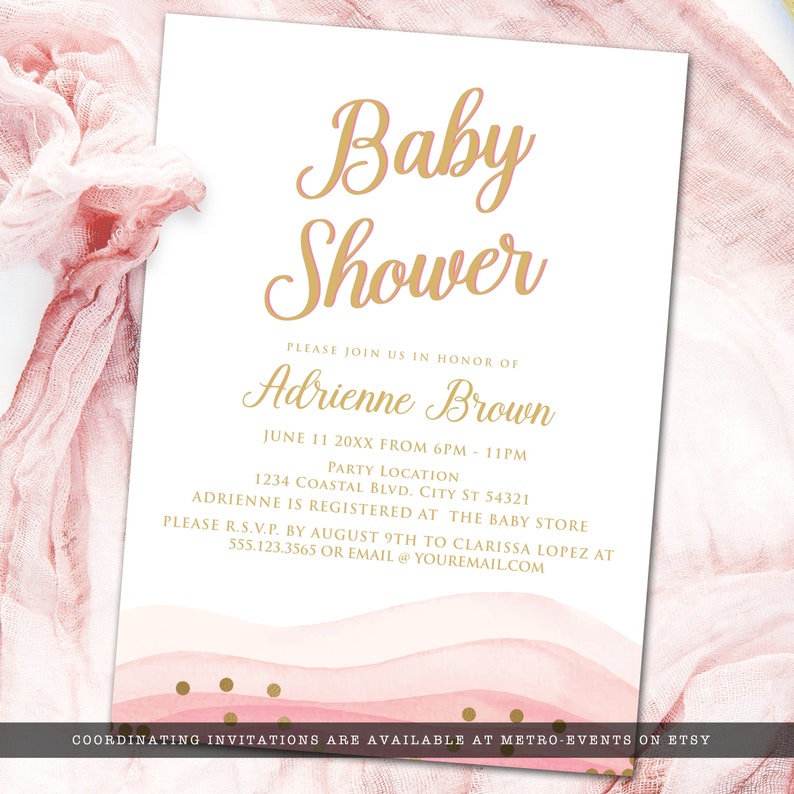 May include: A baby shower invitation with gold script text on a white background. The invitation includes the words "Baby Shower" and event details. Pink watercolor waves and gold polka dots decorate the bottom.