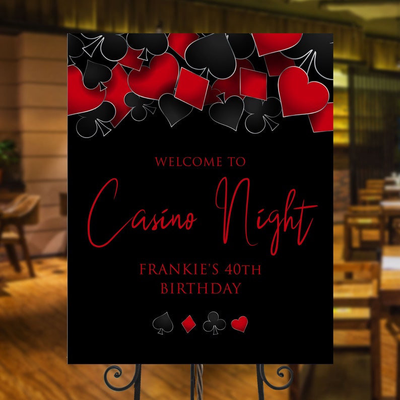 Casino night party signs designed with hearts, diamonds, clubs, and spades framing the top in red and black. Designed By MetroEvents.