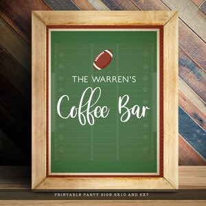 May include: A framed sign featuring a green football field background with yard lines, a brown football, and white text that reads THE WARREN'S Coffee Bar. The sign includes text at the bottom stating PRINTABLE PARTY SIGN 8X10 AND 5X7.