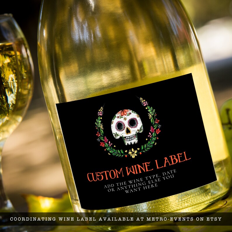 Day of the dead themed party wine label a watercolor-style sugar skull with flower and leaf accents on a black background. Designed By MetroEvents