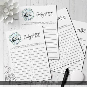 May include: Baby ABC game cards with a panda bear illustration and text. The cards have lines for writing baby-related items for each letter of the alphabet. The text reads, "Write a baby related item that starts with each letter in the alphabet. The first to finish wins!"