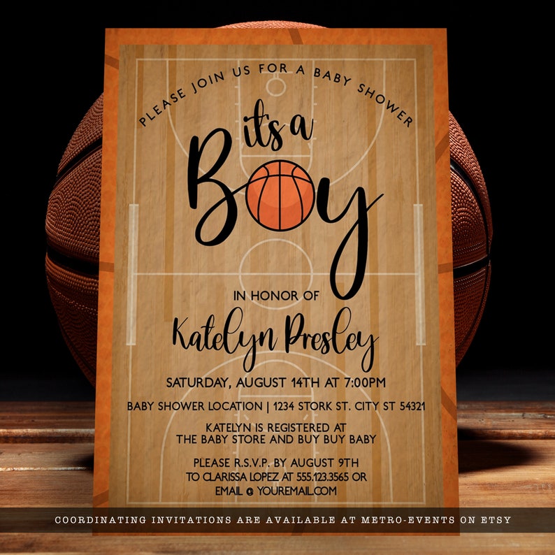 May include: A rectangular baby shower invitation card featuring a basketball court wood grain background. The text reads: Please join us for a baby shower, it's a boy, in honor of Katelyn Presley, Saturday, August 14th at 7:00PM, and registry details.
