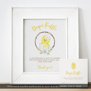 May include: A framed sign with the words "Diaper Raffle" in yellow script, featuring a watercolor chick hatching from an egg. A smaller card with the same design is included. The sign reads "If you brought a pack of diapers..." and "Thank you!"