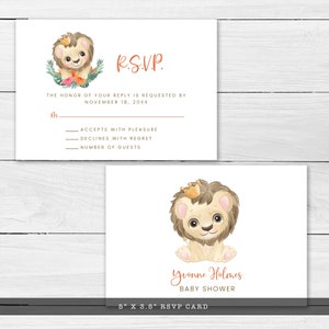 May include: A set of two white RSVP cards. One card features a lion cub illustration with text "R.S.V.P." and details. The second card has a lion cub illustration and the text "Yvonne Holmes BABY SHOWER". The cards measure 5" x 3.5".